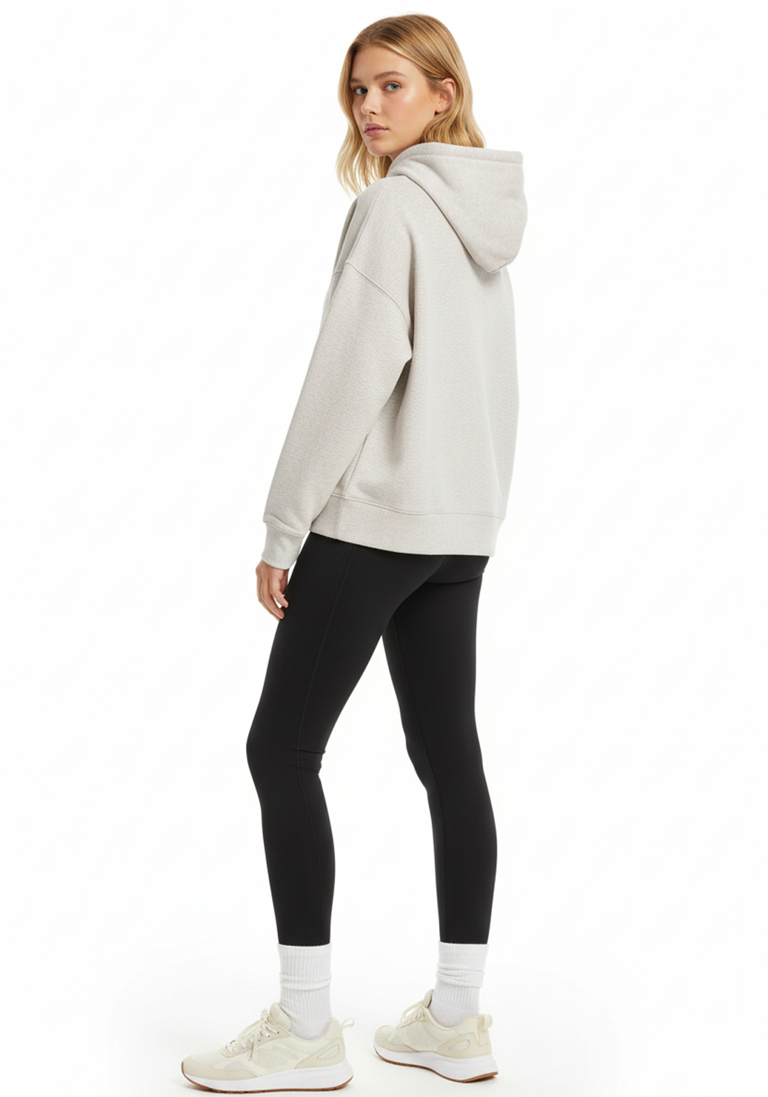 Front three quarter view of Layer Love Your Run hoodie in warm grey on female model