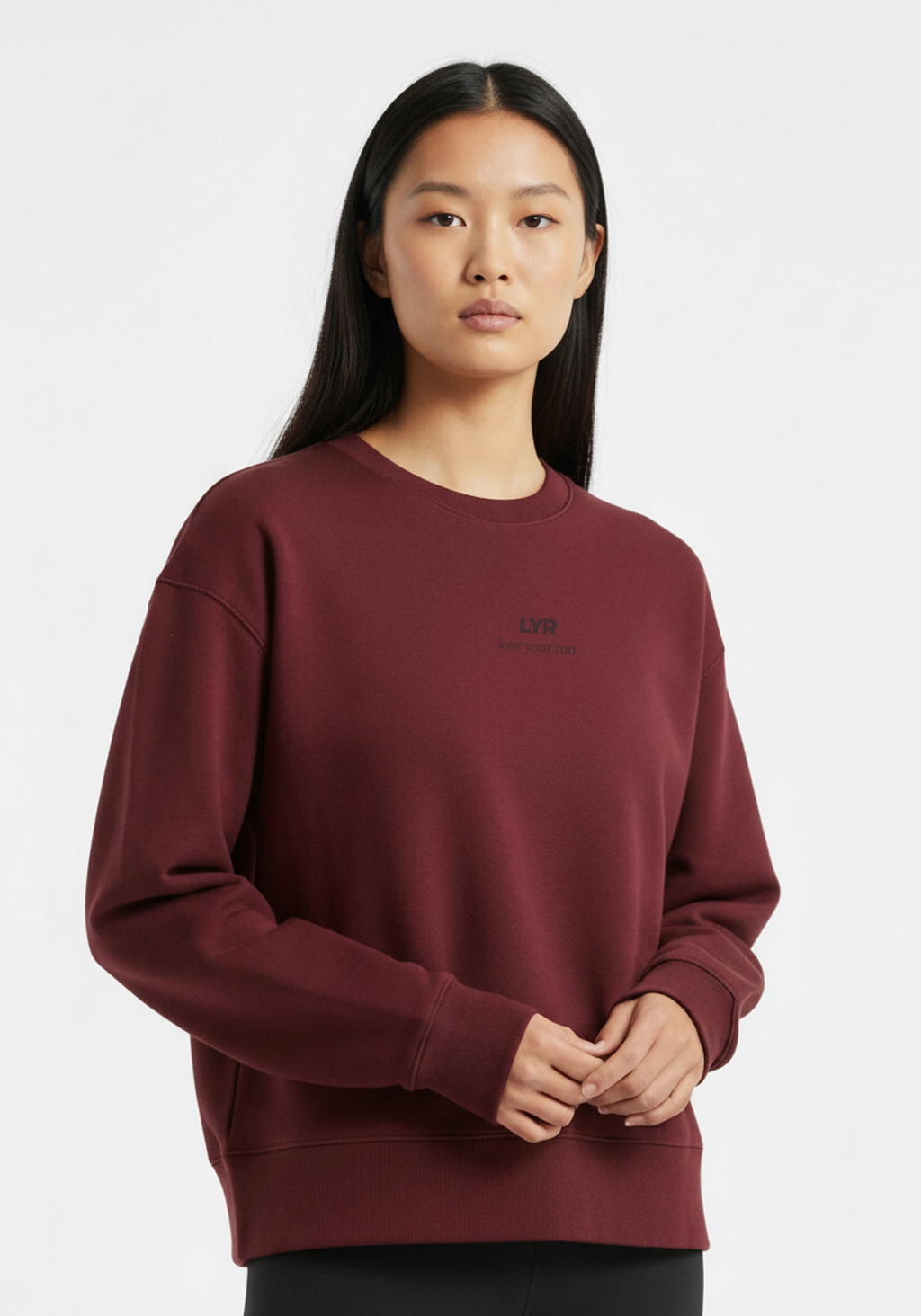 Close up of Womens Layer Love Your Run sweatshirt in burgundy with subtle LYR chest graphic