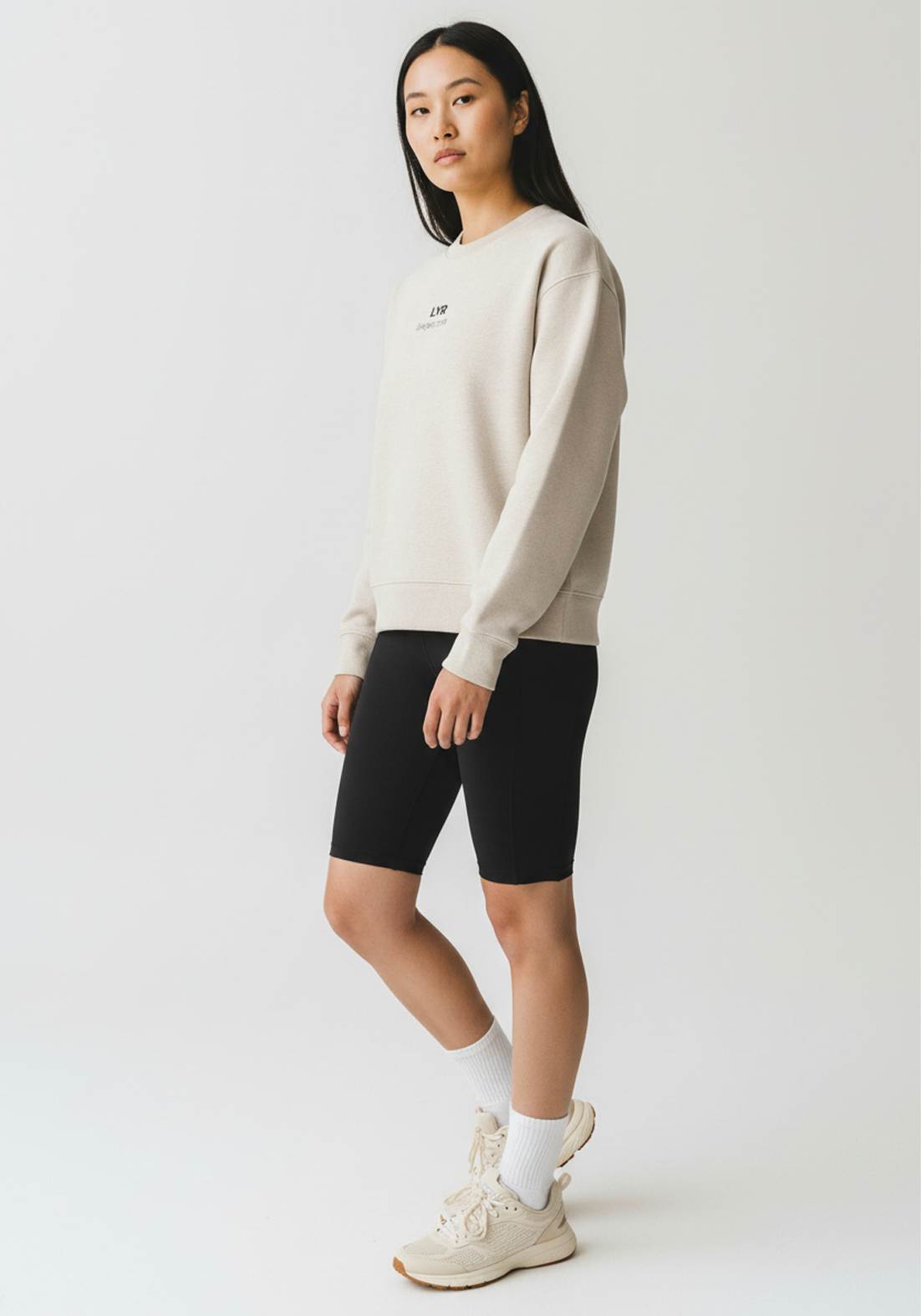 Layer Love Your Run Women's sweatshirt in warm grey, side view on model
