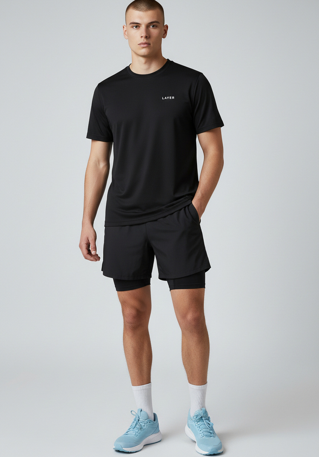 Angled front view of men’s black Layer FTR graphic running tee showing fit and drape