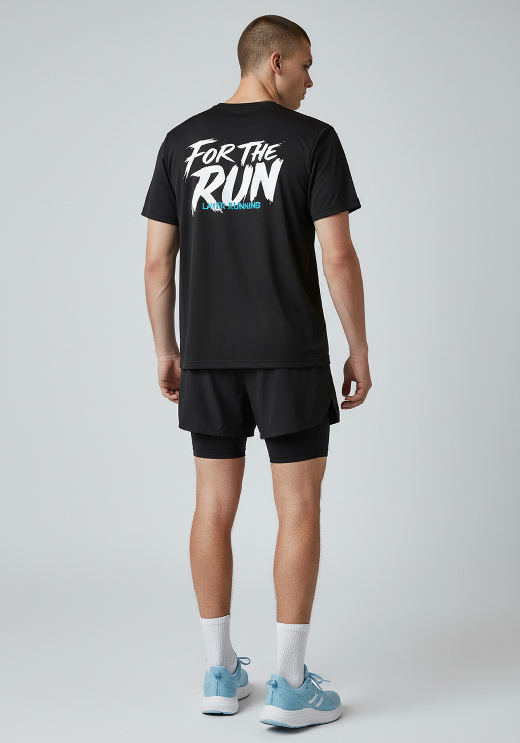 Rear full body view of men’s black Layer FTR graphic running tee and shorts