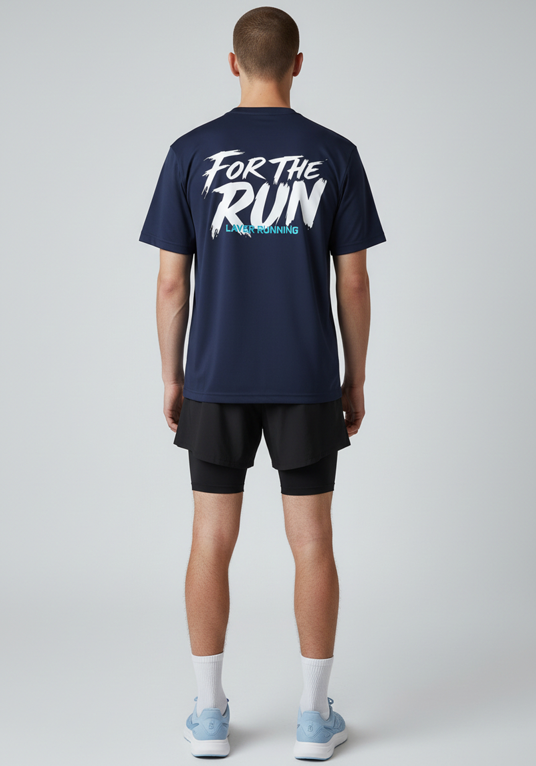 Rear full body view of men’s navy Layer FTR graphic running tee and shorts