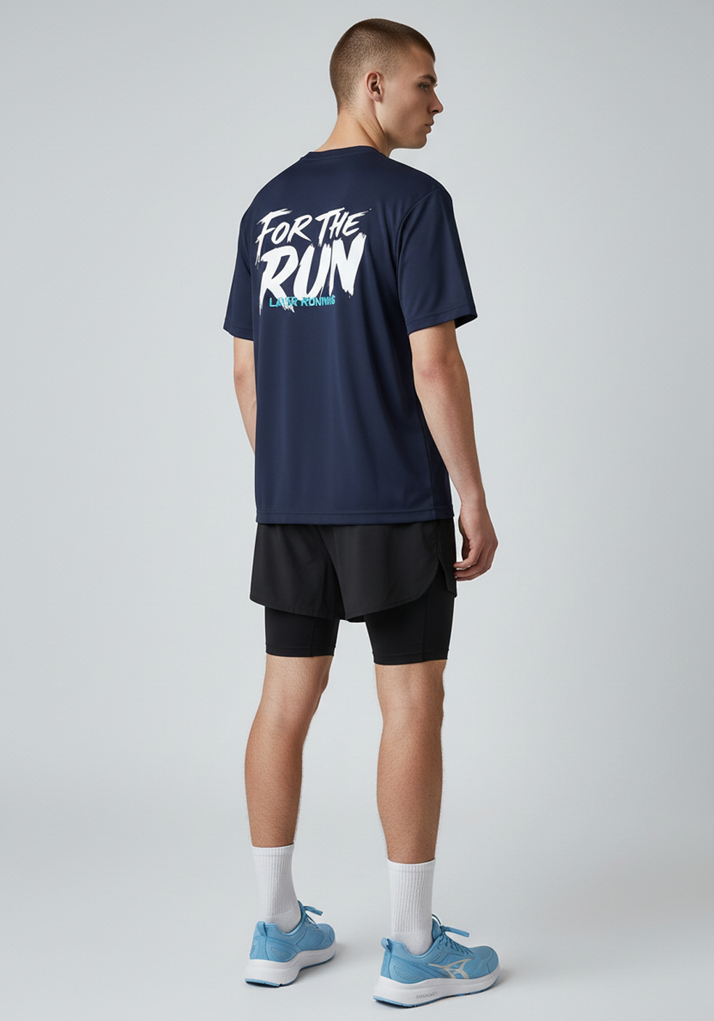 Side back view of men’s navy Layer FTR graphic running tee highlighting rear graphic