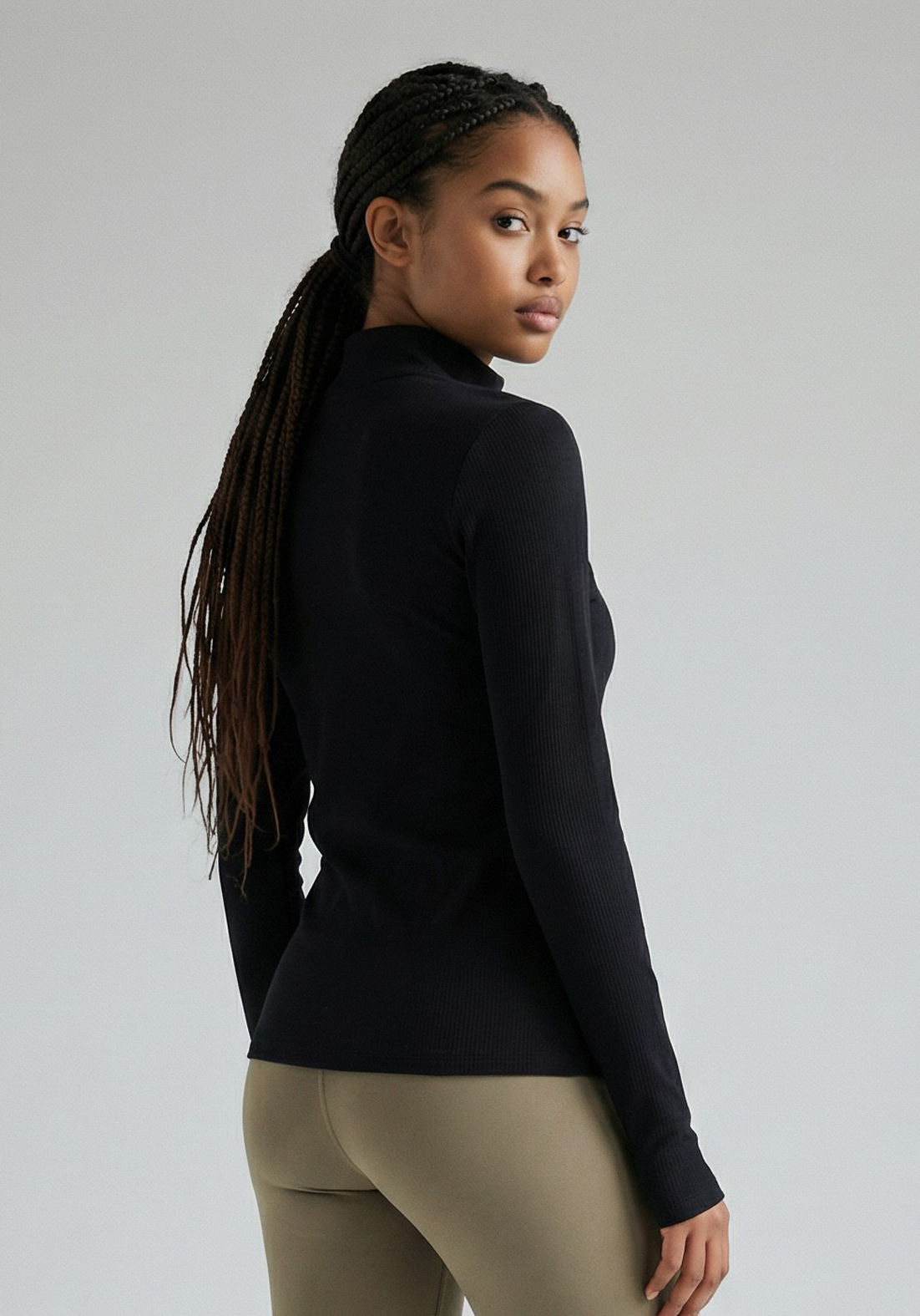 Layer Training 1/4 Zip in black, angled view
