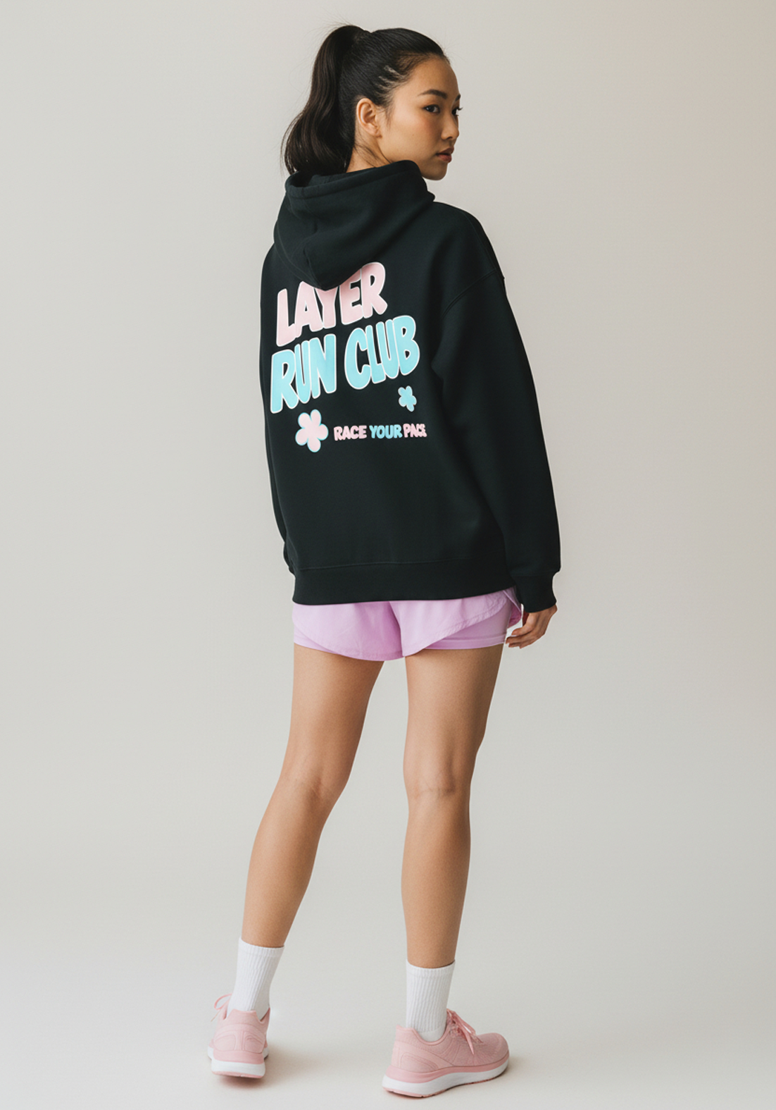 Layer Race Your Pace Run Club Hoodie in black, angled view
