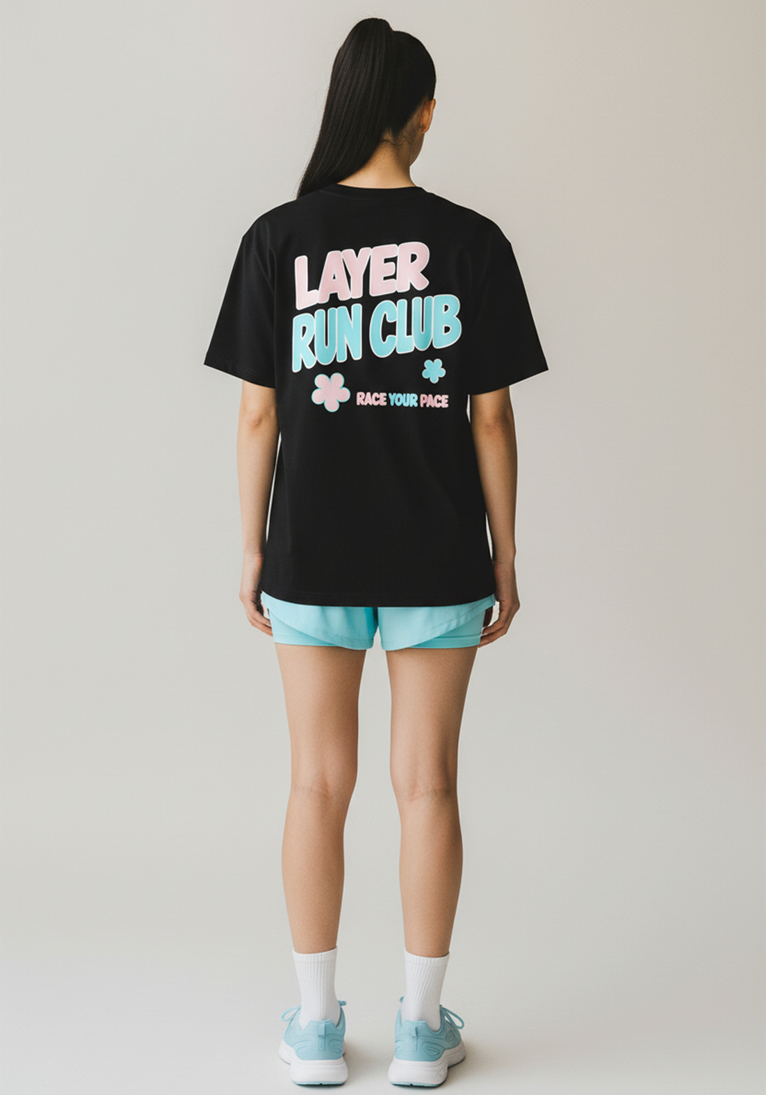 Layer Race Your Pace Run Club Tee in black, back view
