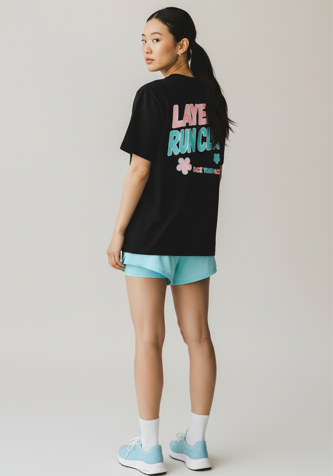 Layer Race Your Pace Run Club Tee in black, back angled view
