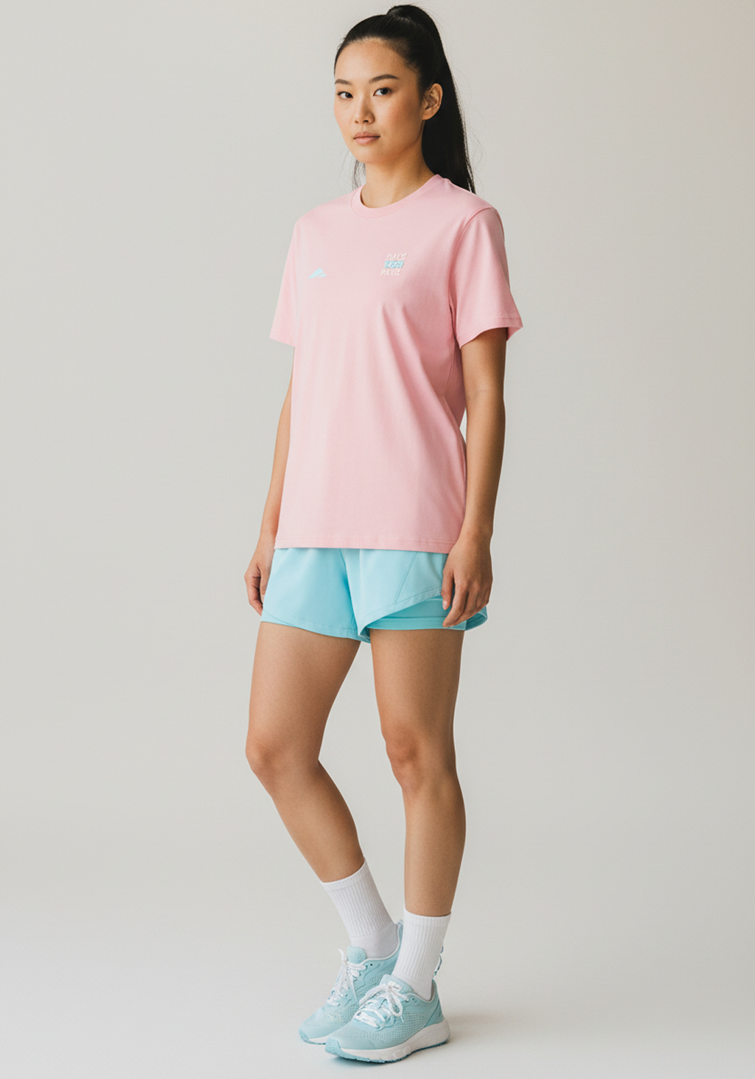 Layer Race Your Pace Run Club Tee in Soft Pink, angled view
