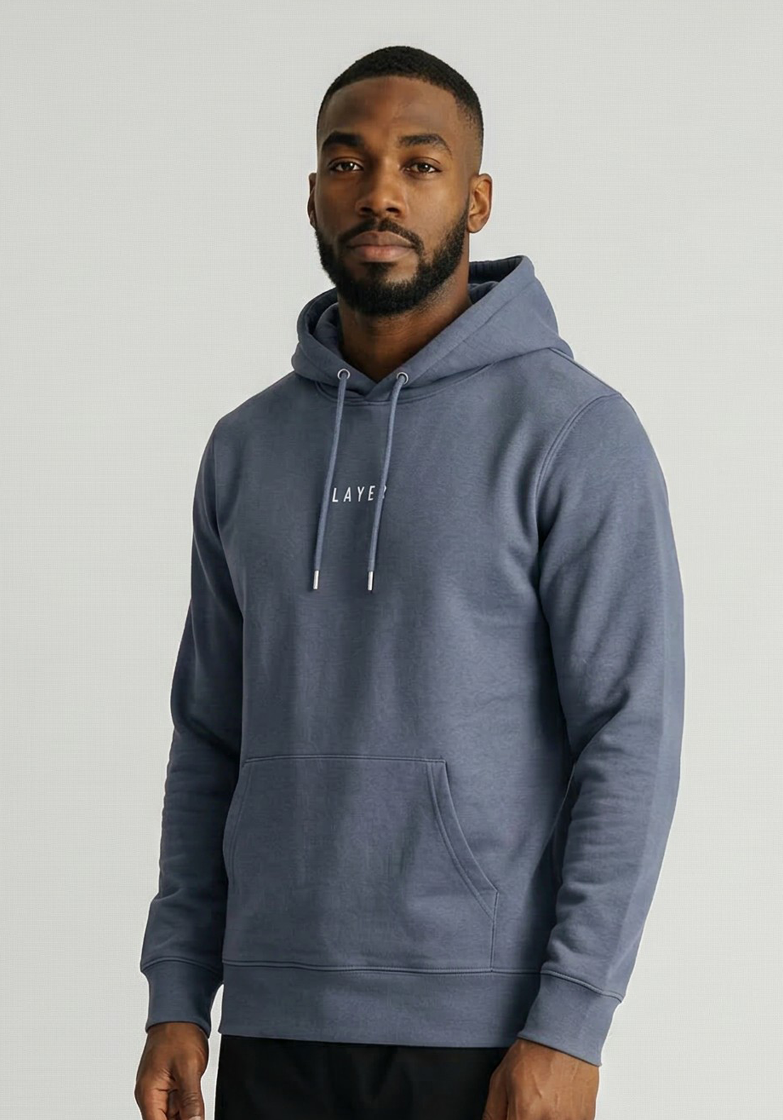 Layer Race Your Pace Symbol Hoodie in Storm, angled view
