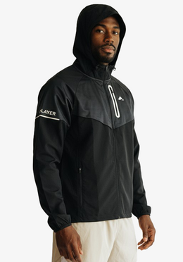 Layer Tempo Running Windbreaker in black worn by runner training
