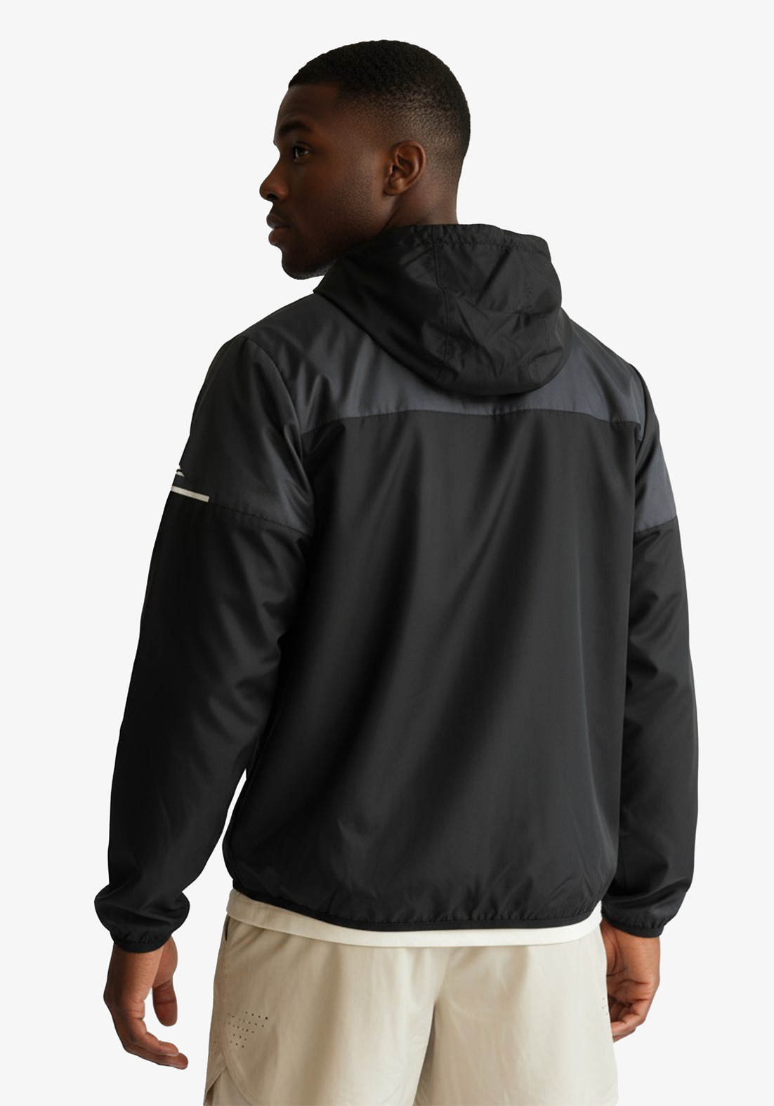 Side view of Layer Tempo Running Windbreaker in black highlighting athletic fit