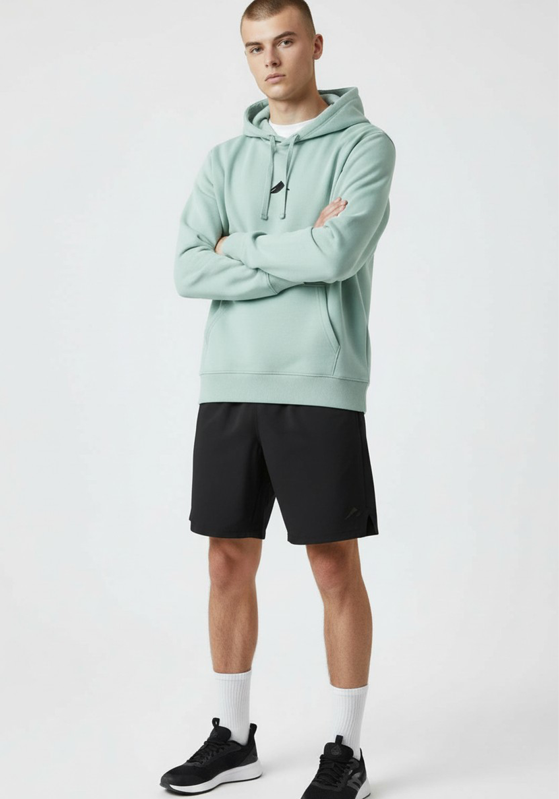 Layer Tempo Training Hoodie in seafoam green front view worn by male athlete relaxed athletic fit