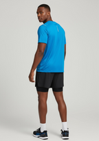 Layer Men’s Tempo Running Tee in aqua – on-model back view showing breathable technical fabric and clean finish