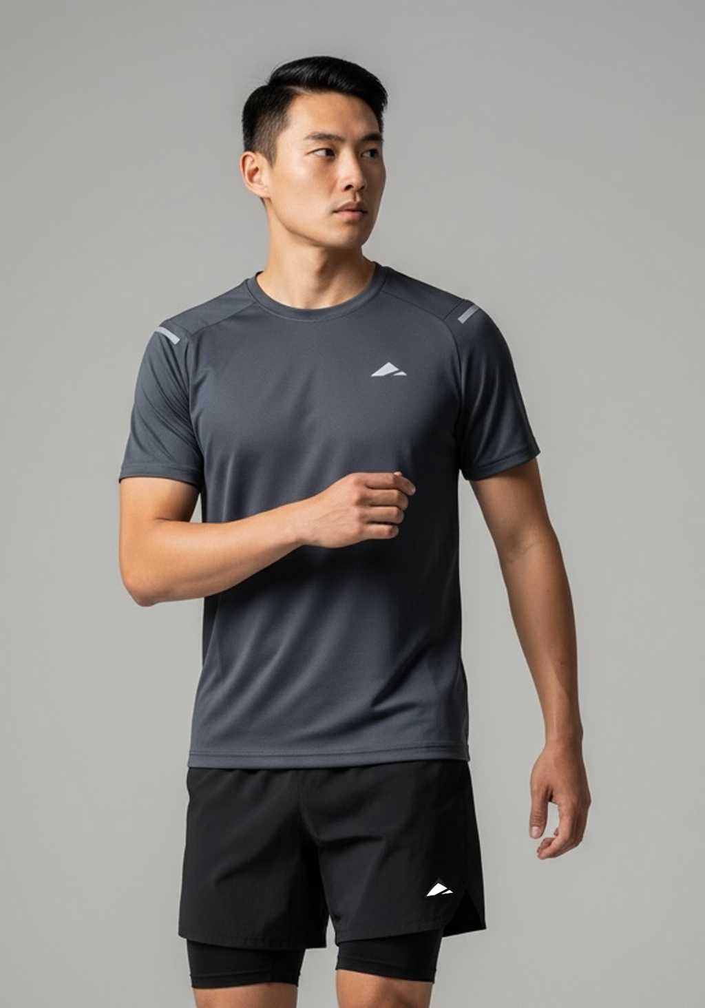 Layer Men’s Tempo Running Tee in graphite – close-up detail highlighting smooth stretch fabric and reflective Layer logo