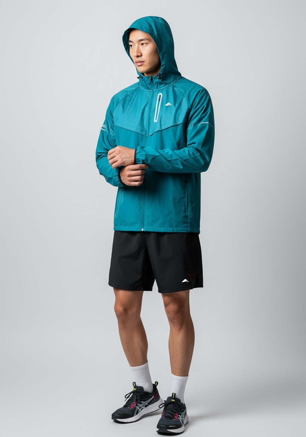 Layer Men’s Tempo Windbreaker in alpine green – alternate on-model front view highlighting adjustable hood and technical seams