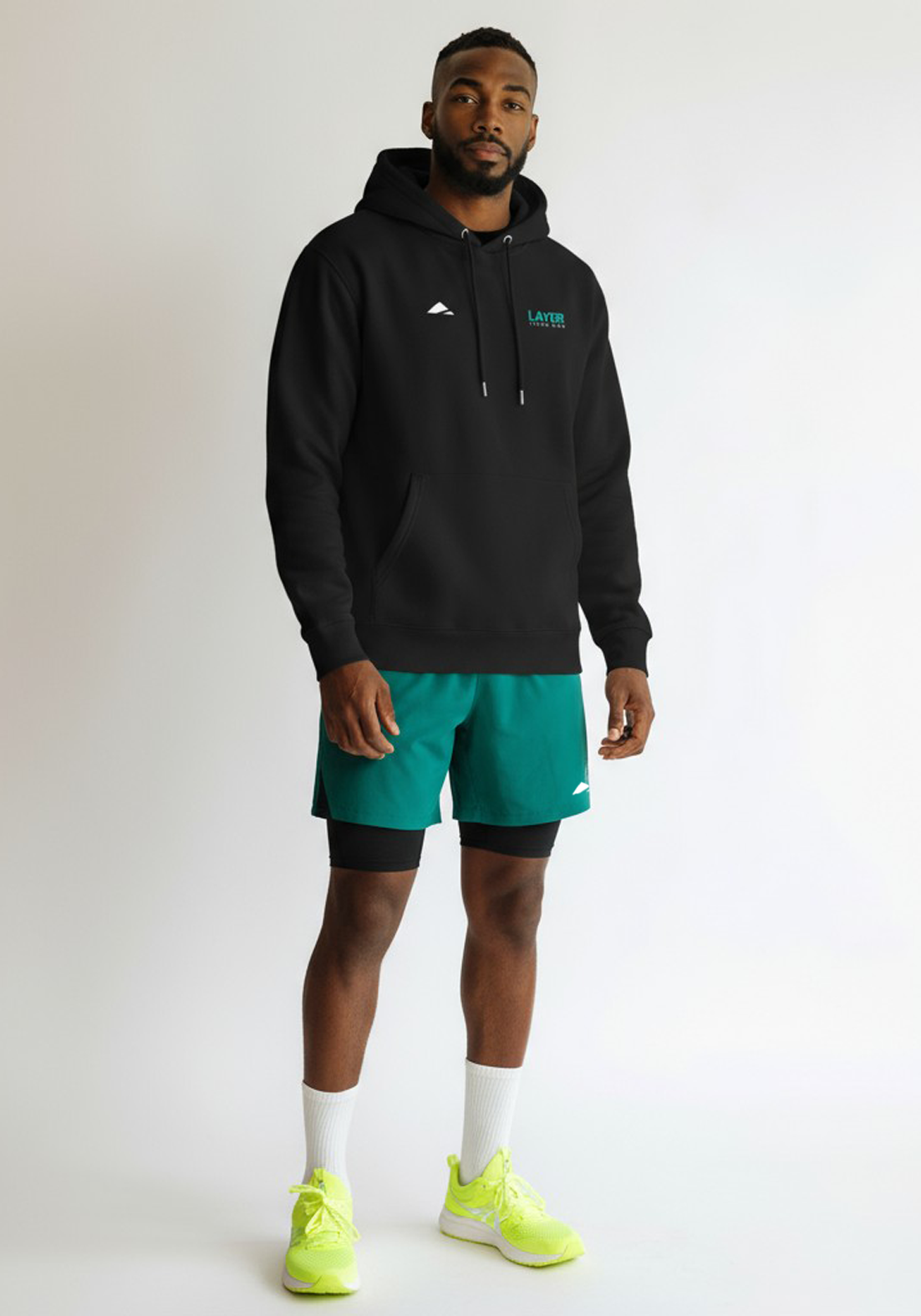 Layer Track Club hoodie in black, front view on model
