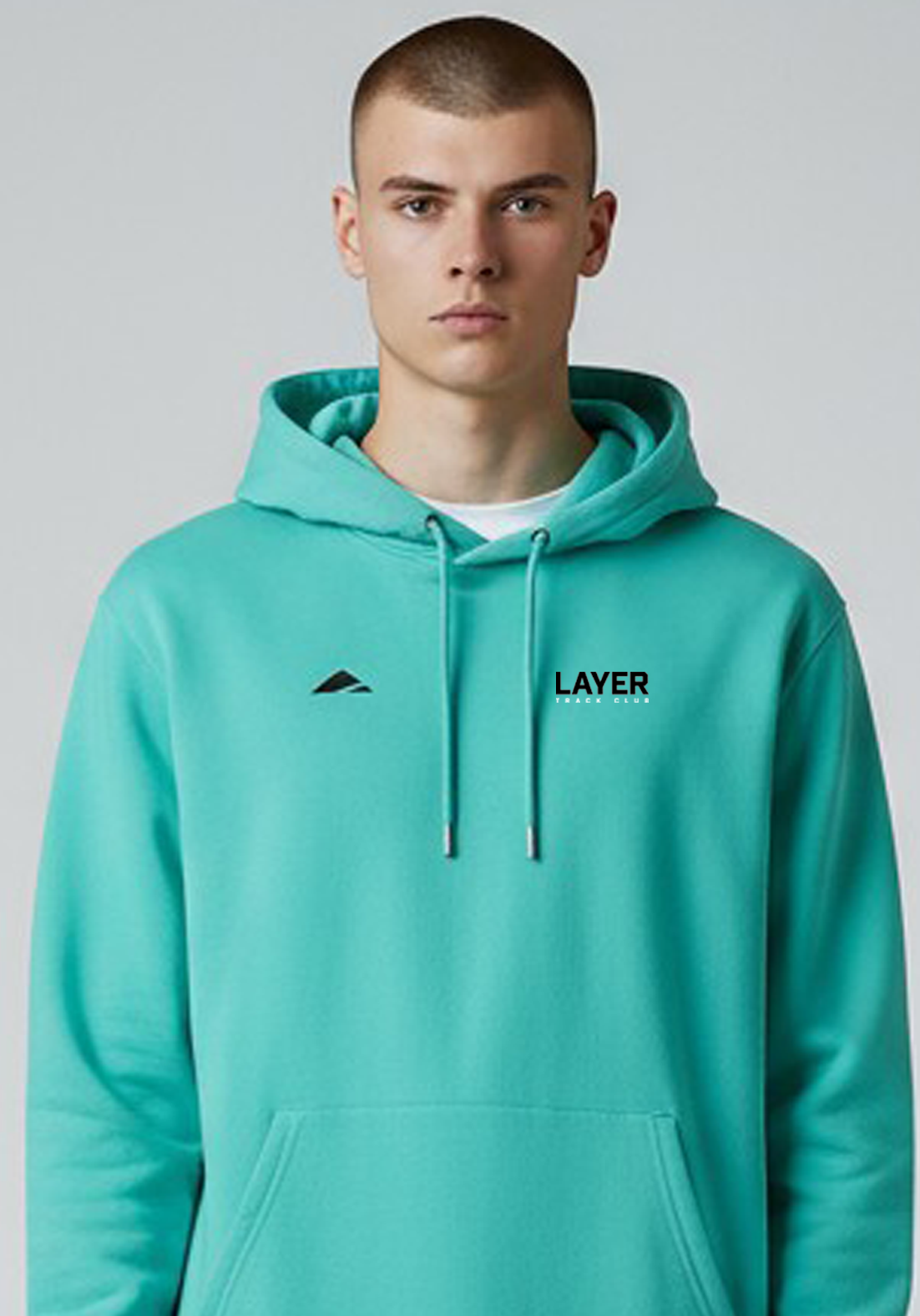 Layer Men’s Track Club Hoodie in teal – close-up front view showing minimalist logo and smooth cotton fabric