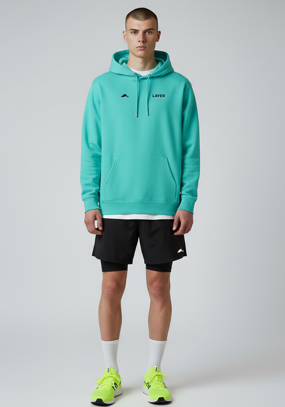 Layer Track Club hoodie in teal, full-length front view on model

