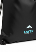 Close up of Layer Track Club logo printed on black training kit bag