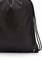 Detail of black drawstring cord and reinforced eyelet on Layer Track Club Kit Bag