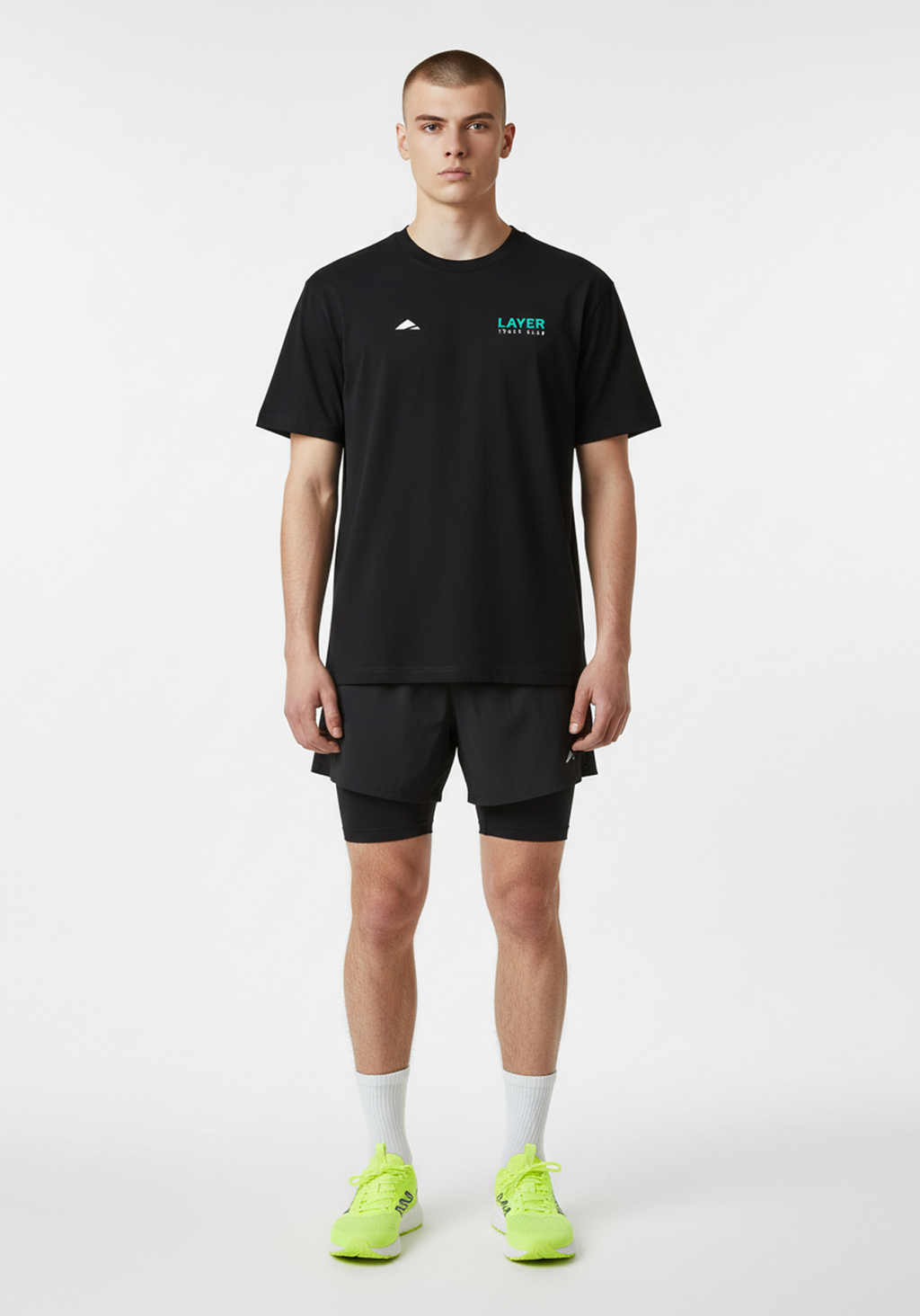 Model wearing the Layer Track Club Tee in black with Layer Track Club logo and relaxed everyday fit.