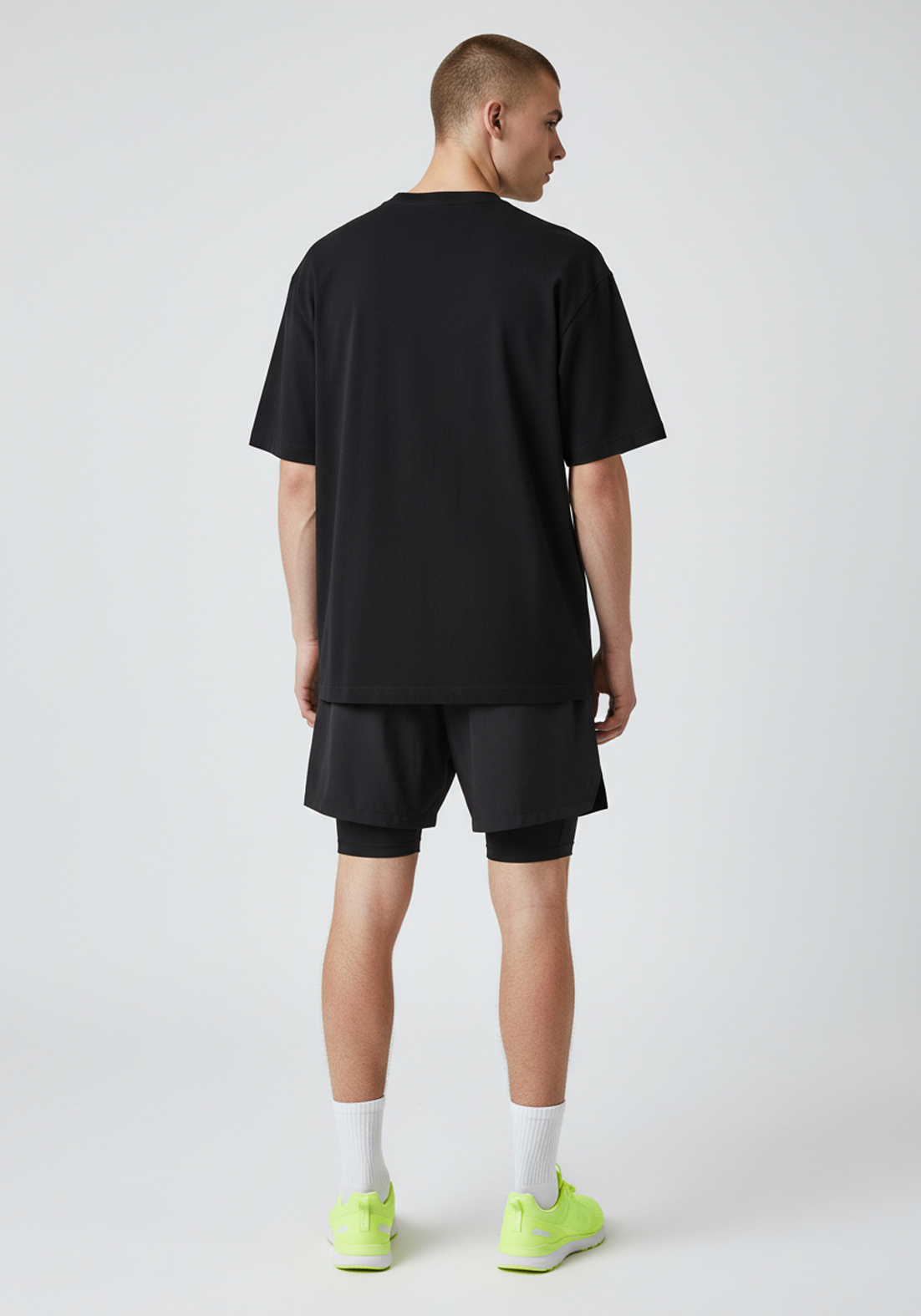 Back view of the black Layer Track Club Tee with a clean unbranded rear.
