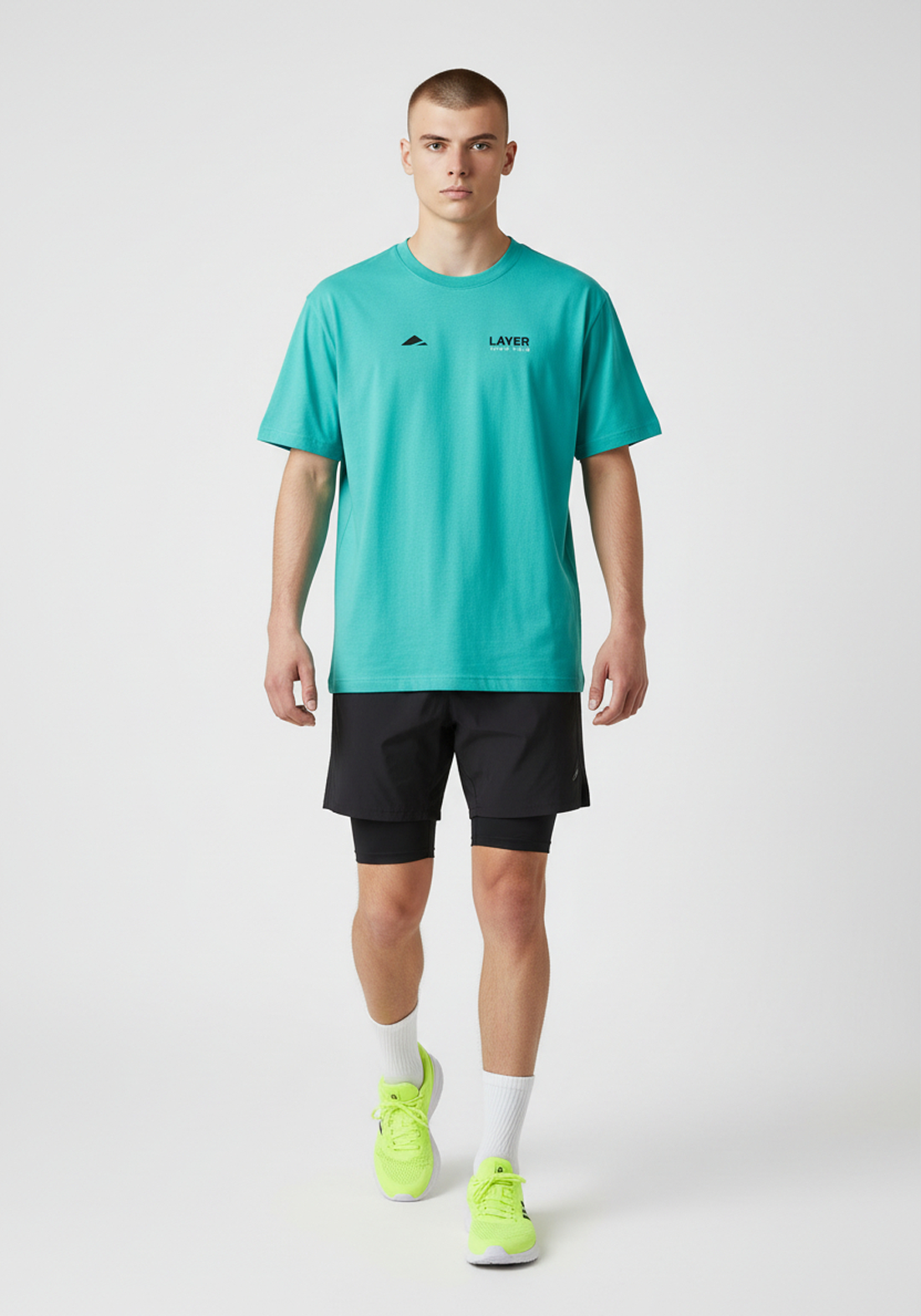 Layer Track Club Tee in teal, full-length view on-model
