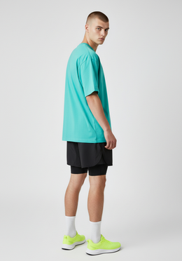 Layer Track Club Tee in teal, side view on-model
