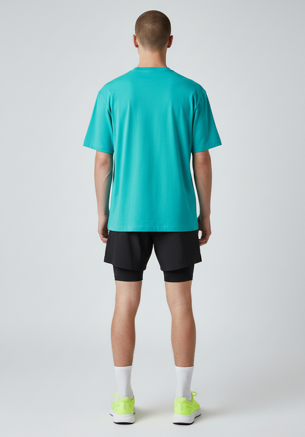 Back view of the teal Layer Track Club Tee with minimalist design.