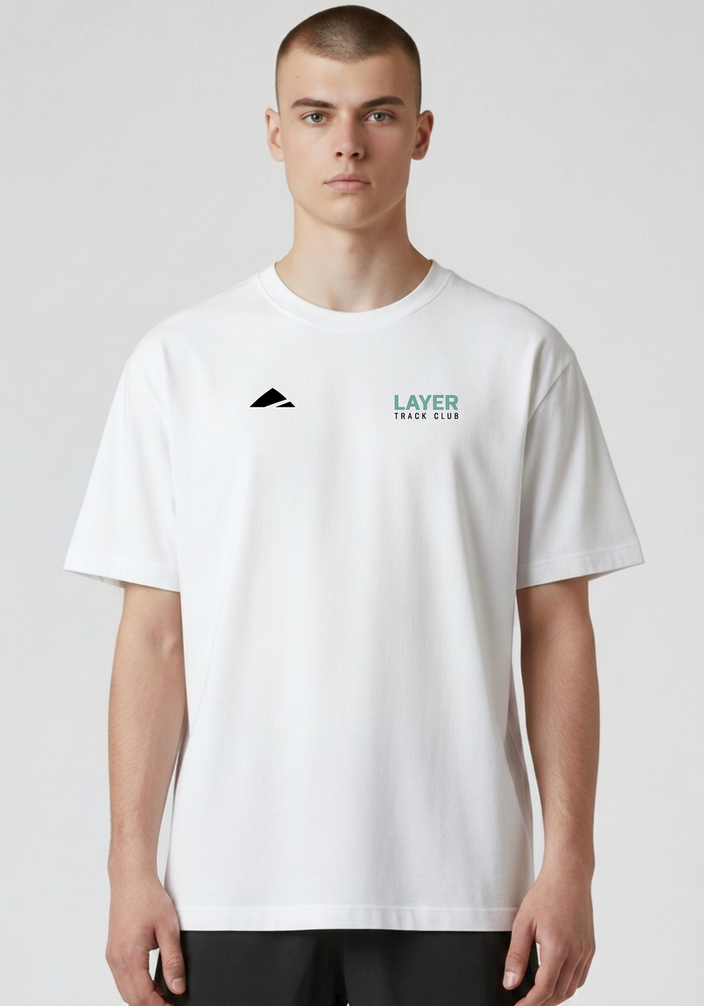 Layer Track Club Tee in white, detail of Layer logo
