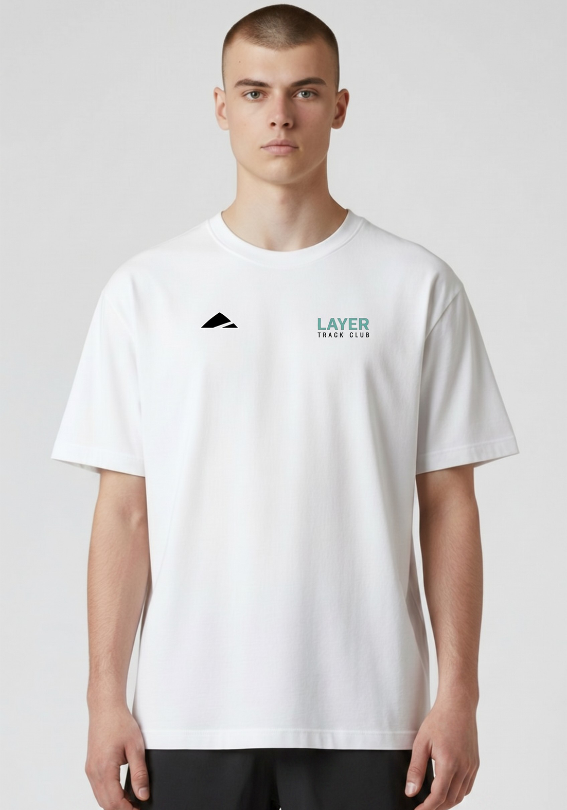 Layer Track Club Tee in white, detail of Layer logo
