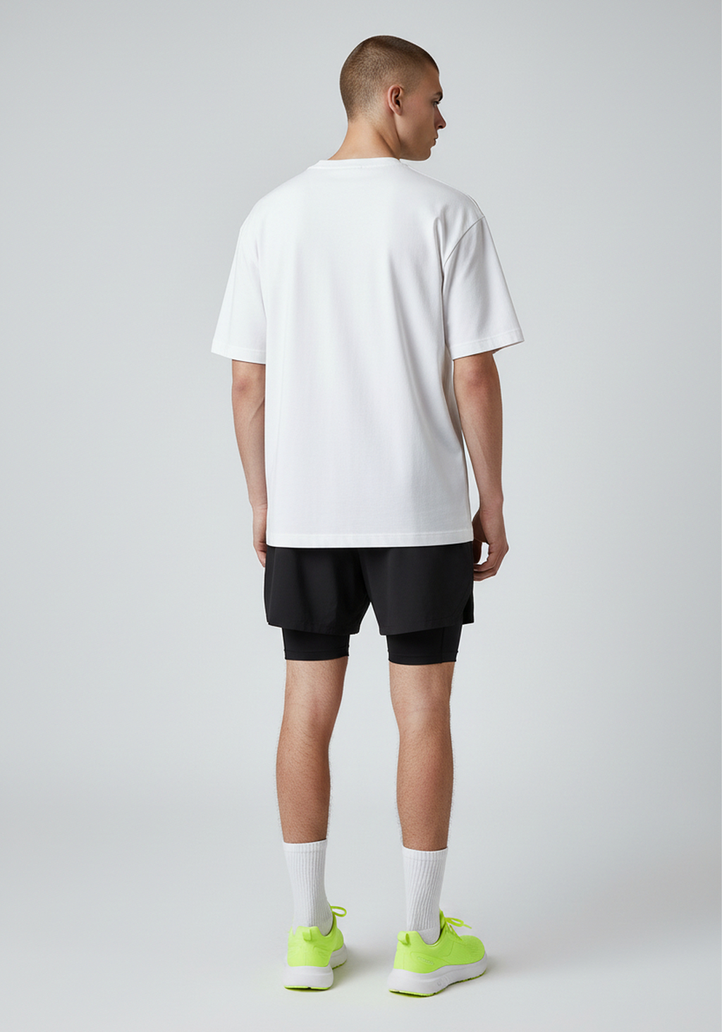 Back view of white Layer Track Club tee on model