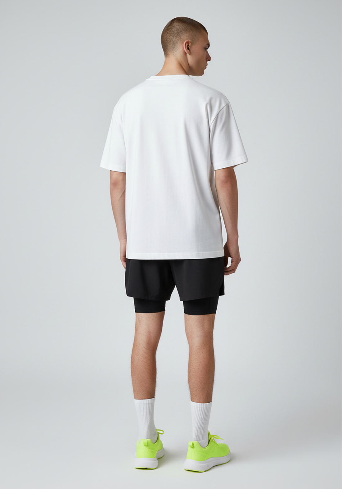 Back view of white Layer Track Club tee on model