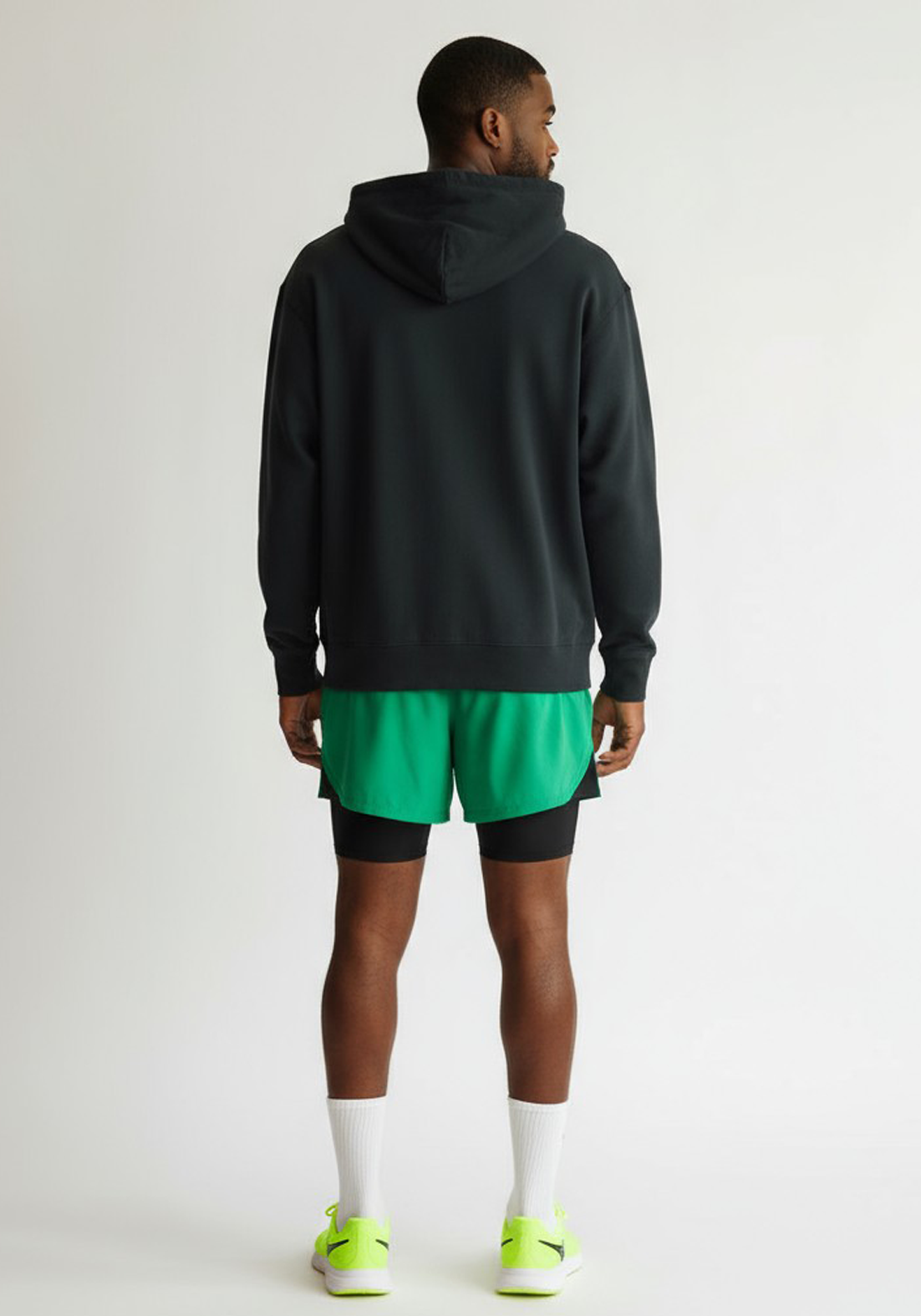 Layer Men’s Track Club Hoodie in black – on-model back view showing relaxed silhouette and tonal logo detail