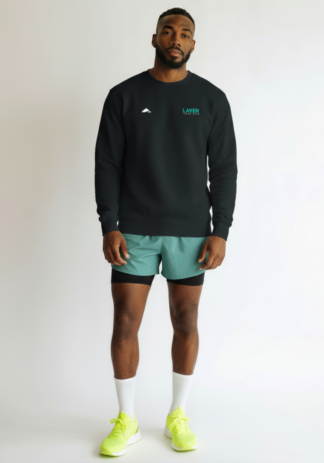 Layer Track Club sweatshirt in black, front view on model
