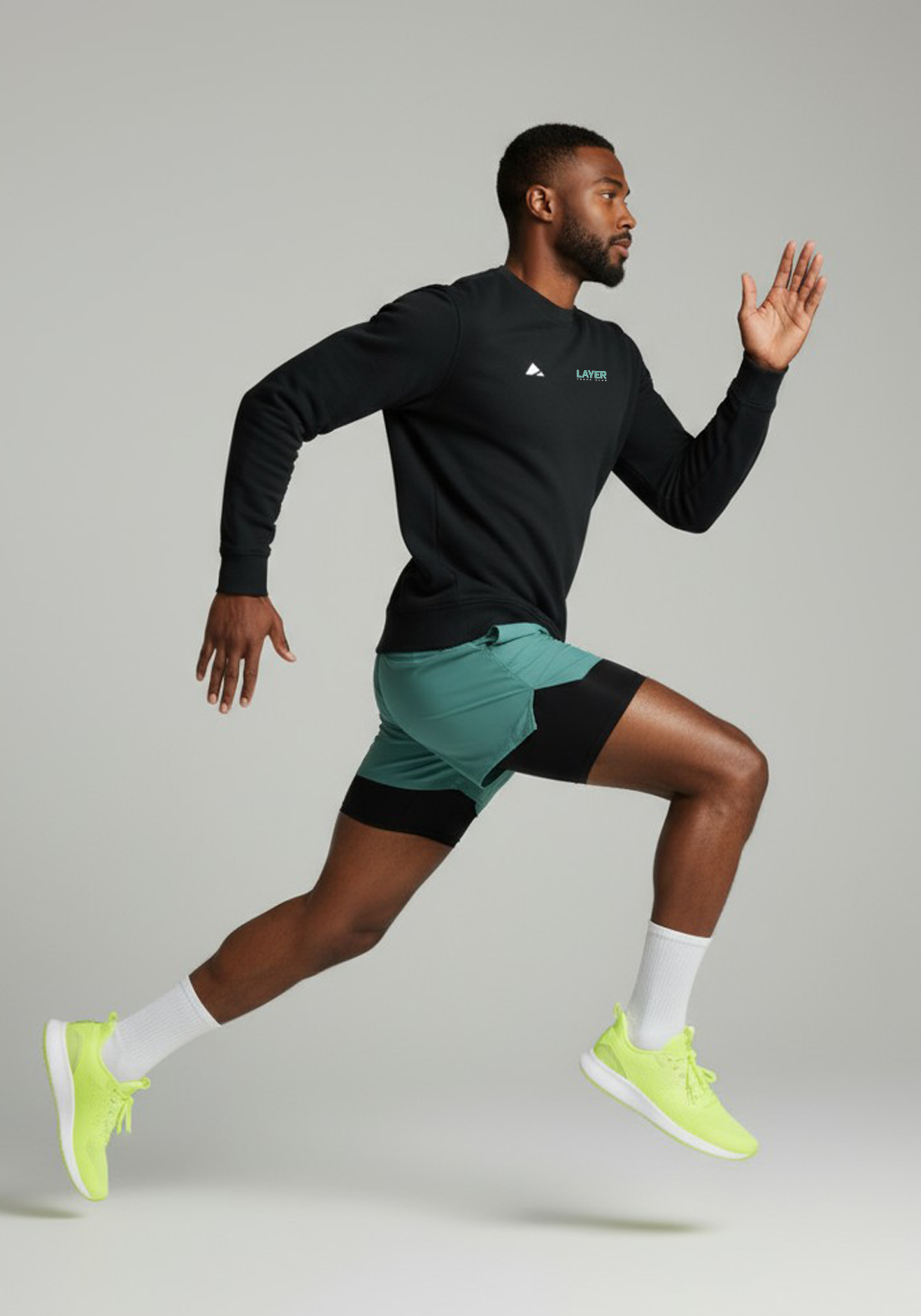 Layer Track Club sweatshirt in black, side view on model
