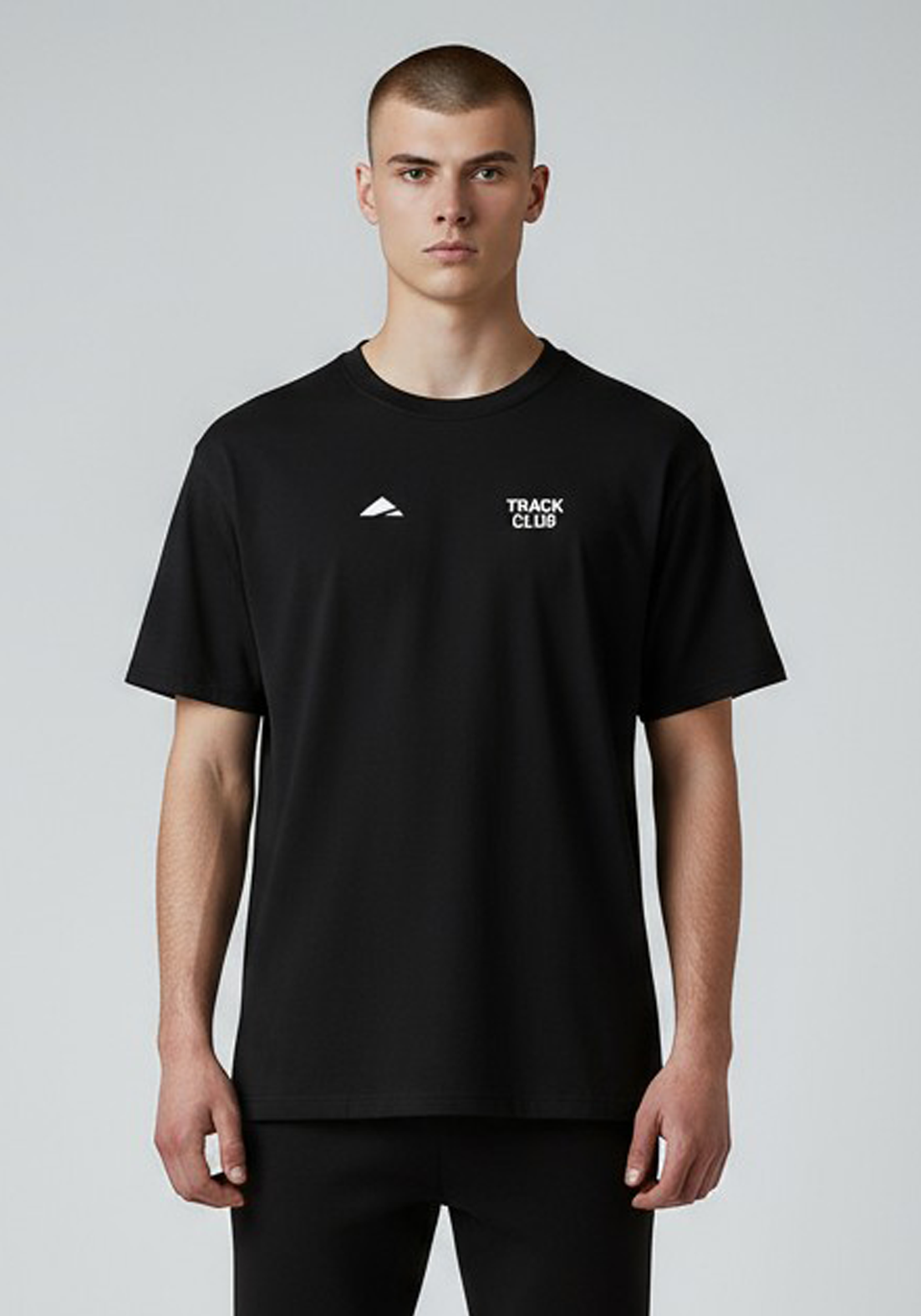 Layer Track Club Tee in black – close-up front view highlighting Track Club chest logo and crew neckline