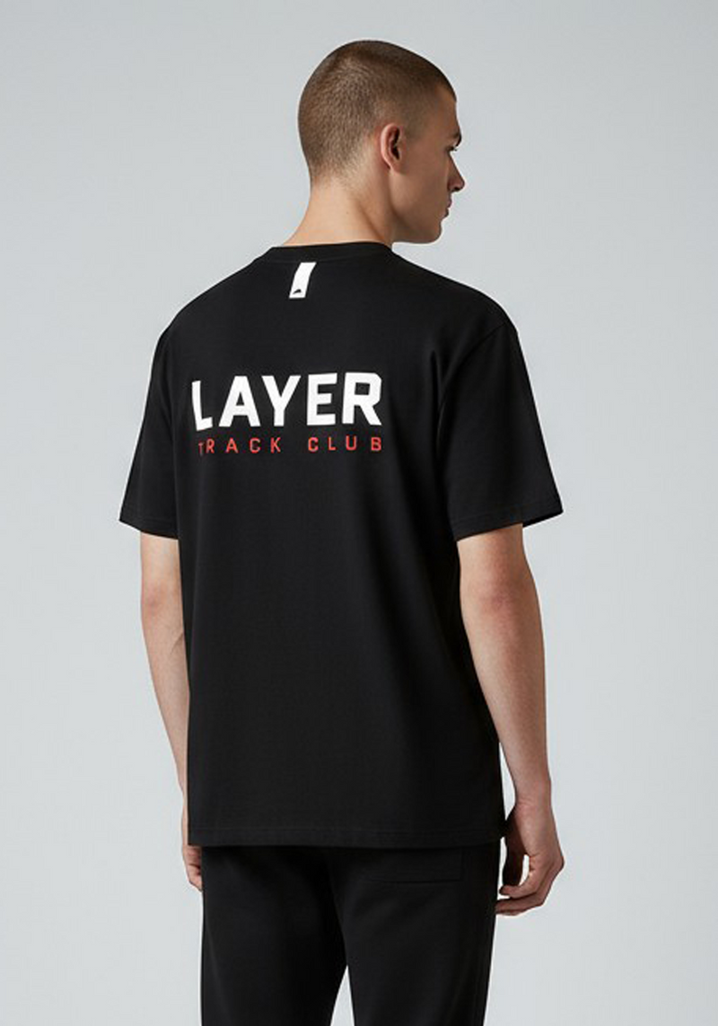 Layer Track Club Tee in black – angled back view showing bold LAYER TRACK CLUB back print in white and red
