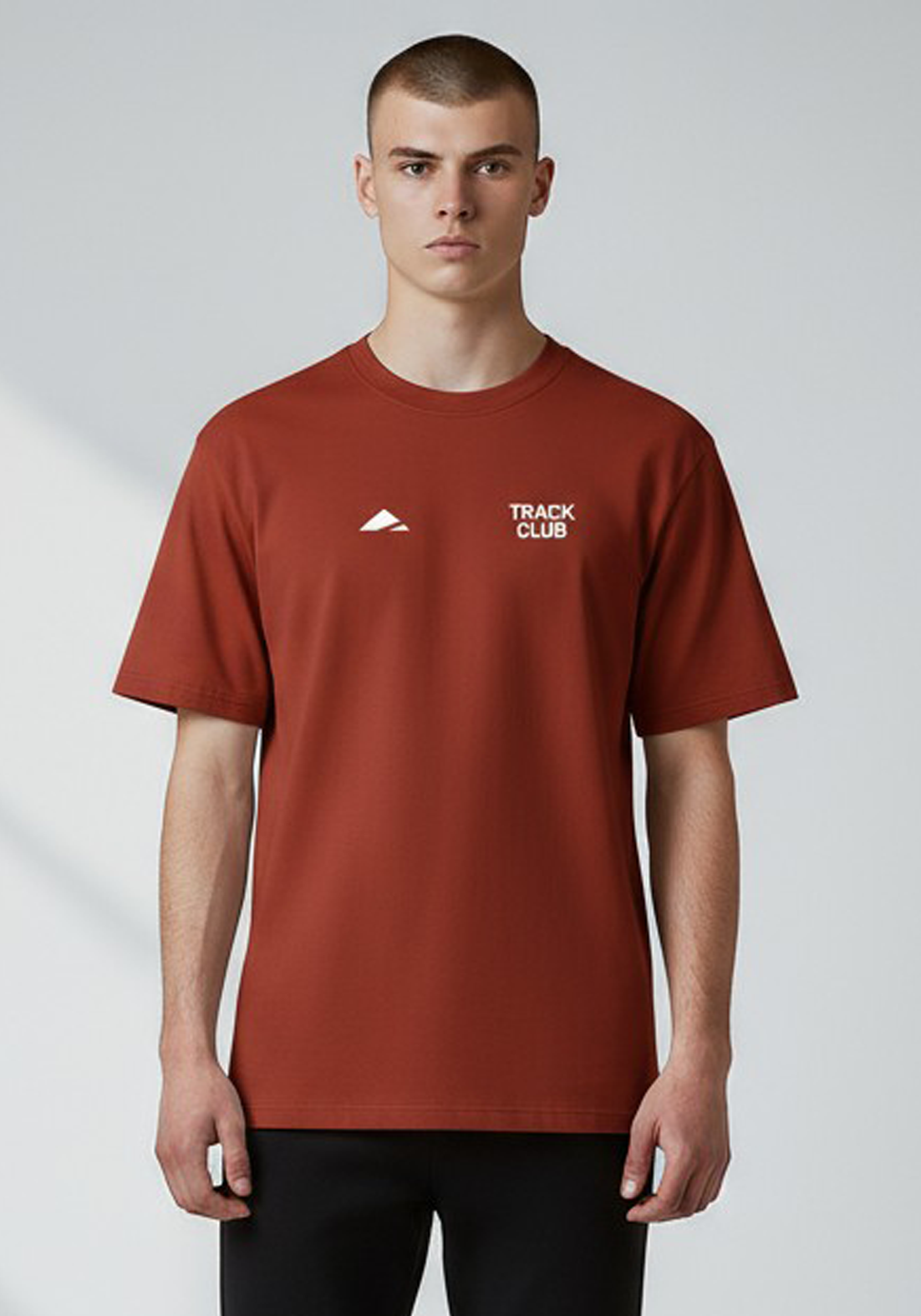 Layer Track Club Tee in Deep Red – front view on model showing Track Club chest print and relaxed athletic fit