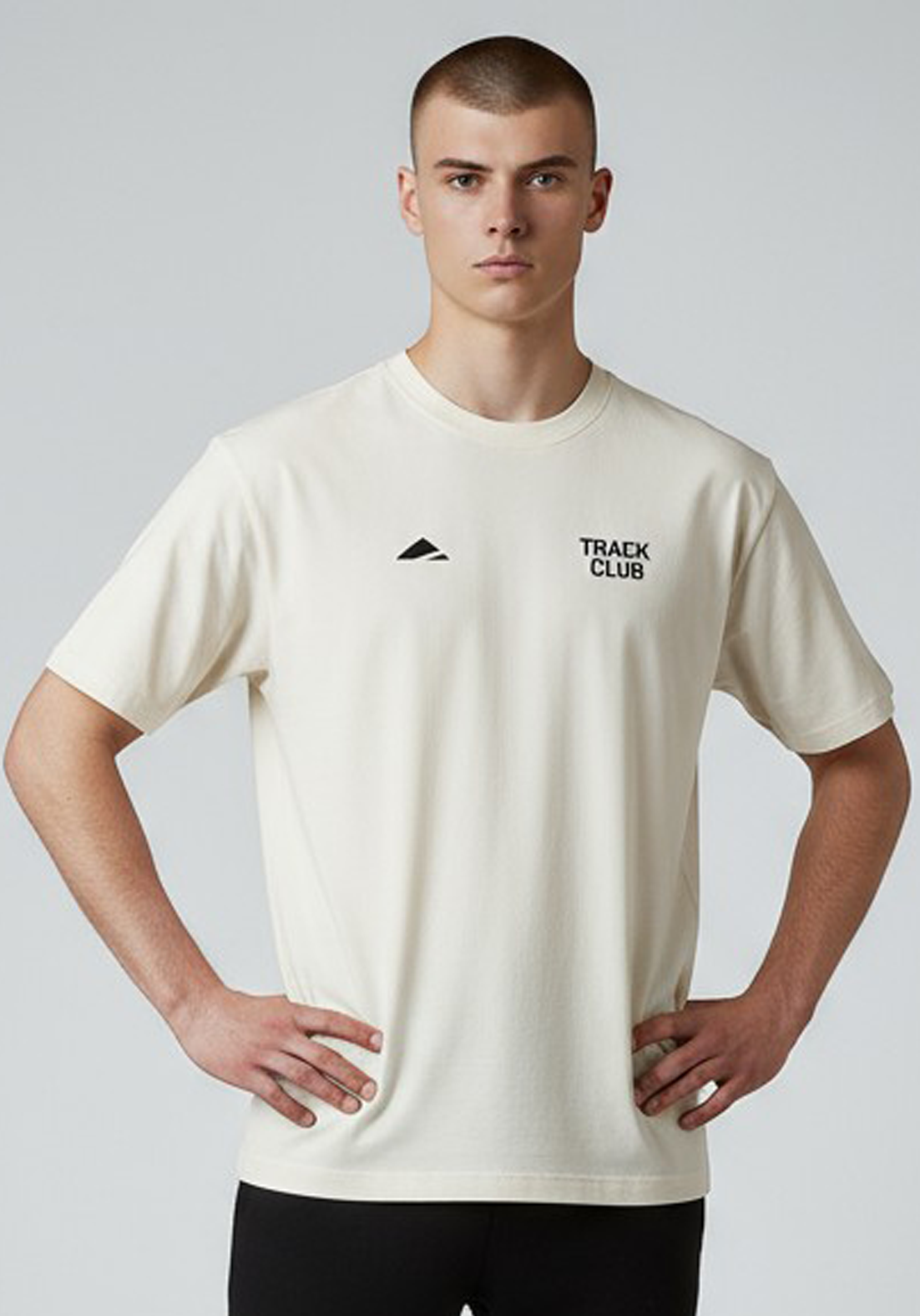 Layer Track Club Tee in Dune White – close-up front view showing small Track Club chest print and crew neckline