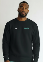 Layer Track Club sweatshirt in black worn by male model front view with Layer logo on chest
