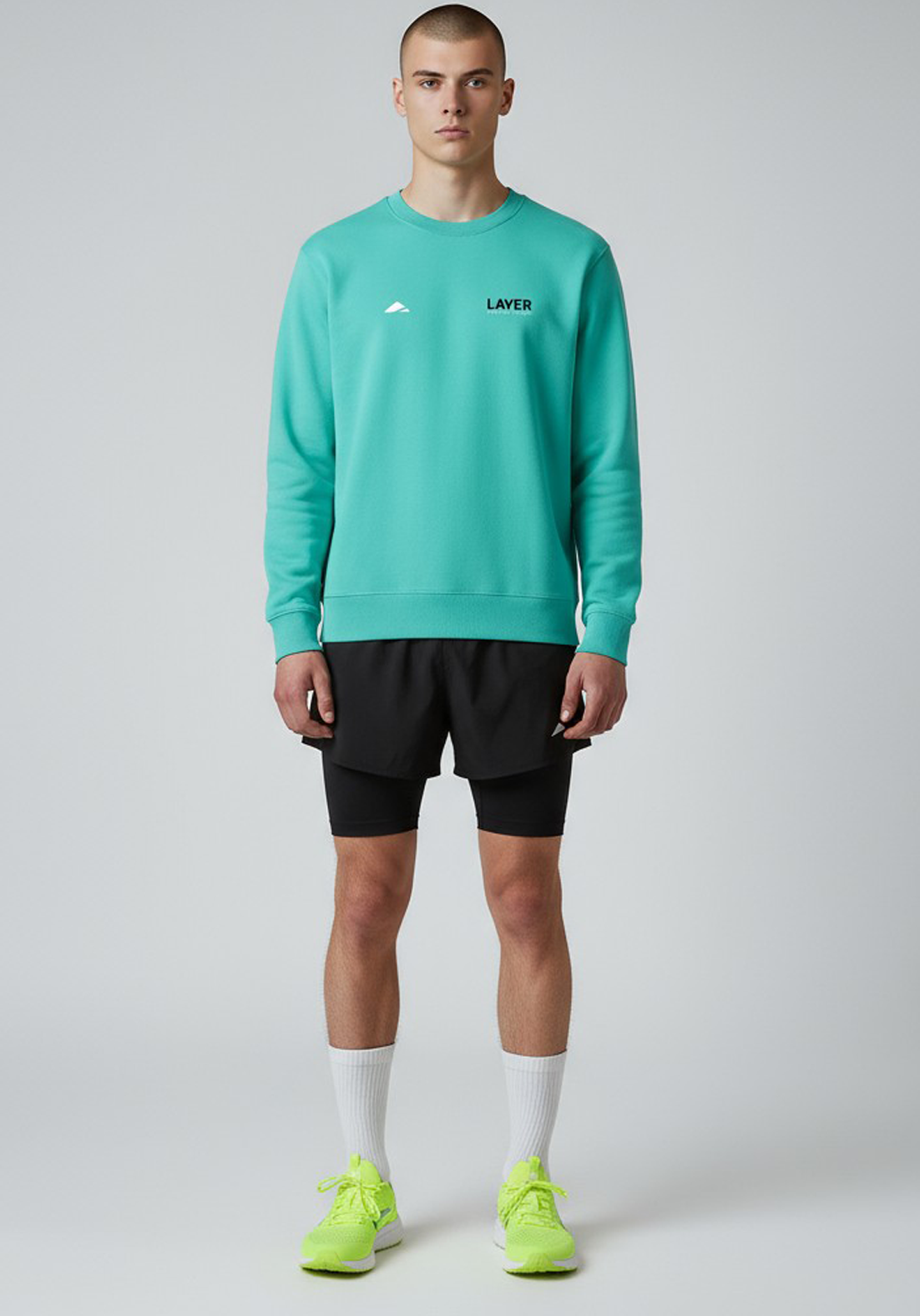 Layer Track Club sweatshirt in teal, front view on model
