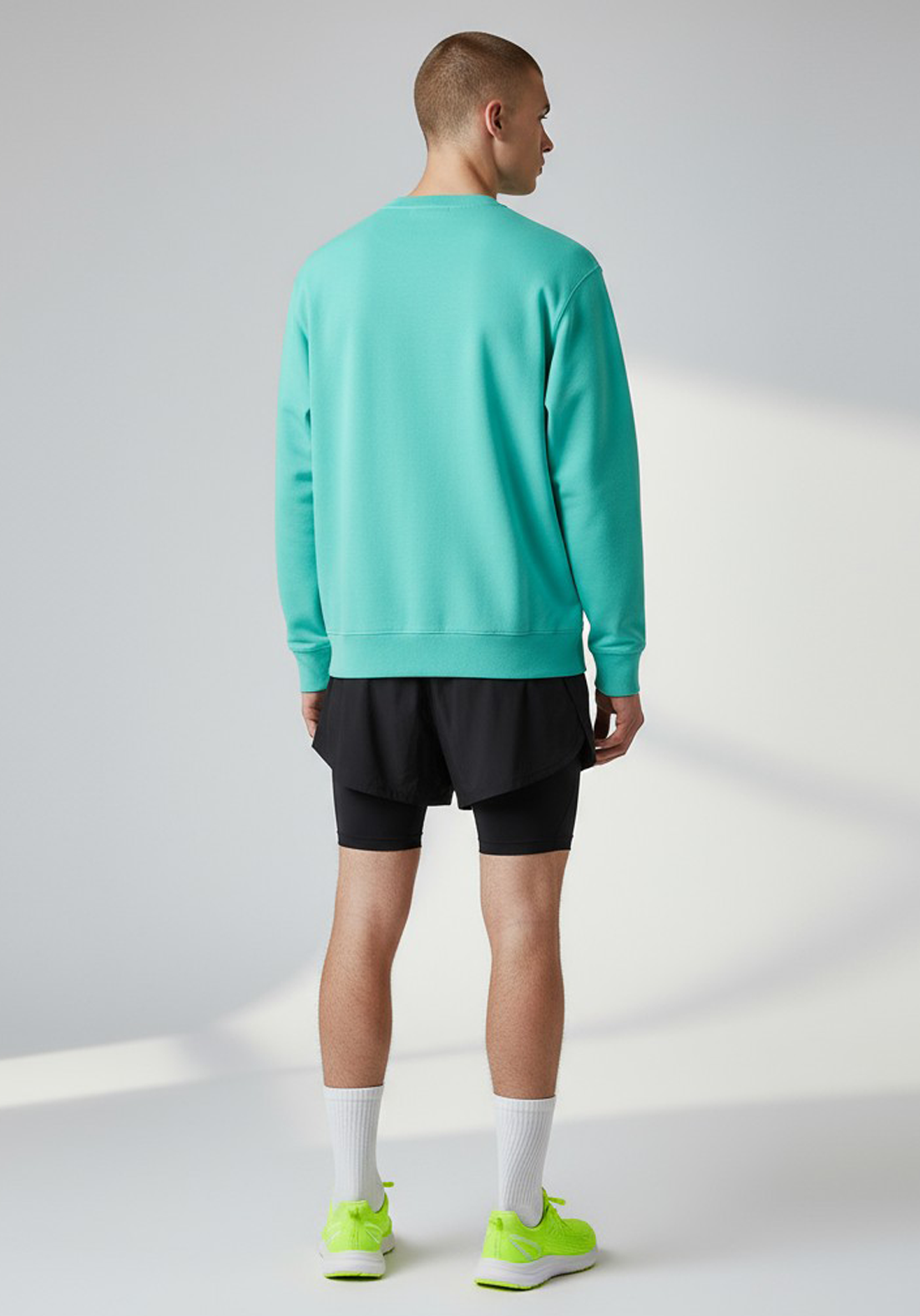 Layer Track Club sweatshirt in teal, back view on model
