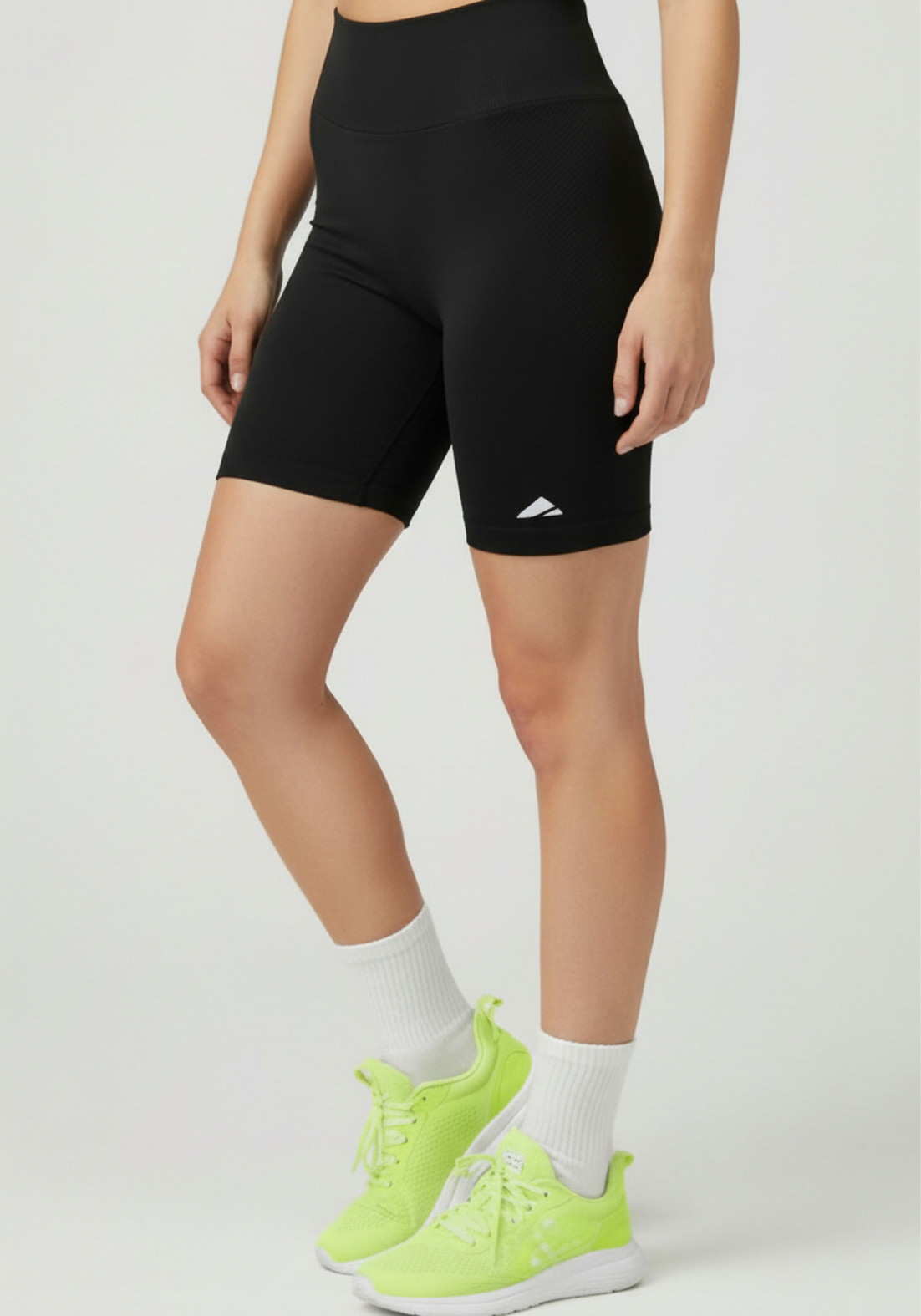 Front side view of women wearing black Layer Training Legging Shorts with high-rise waistband and compression fit.