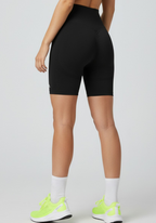 Rear view of black Layer Training Legging Shorts showing high-waisted fit and subtle scrunch detail.