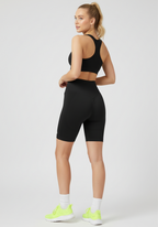 Angled rear side view of black Layer Training Legging Shorts highlighting shape and compression. 