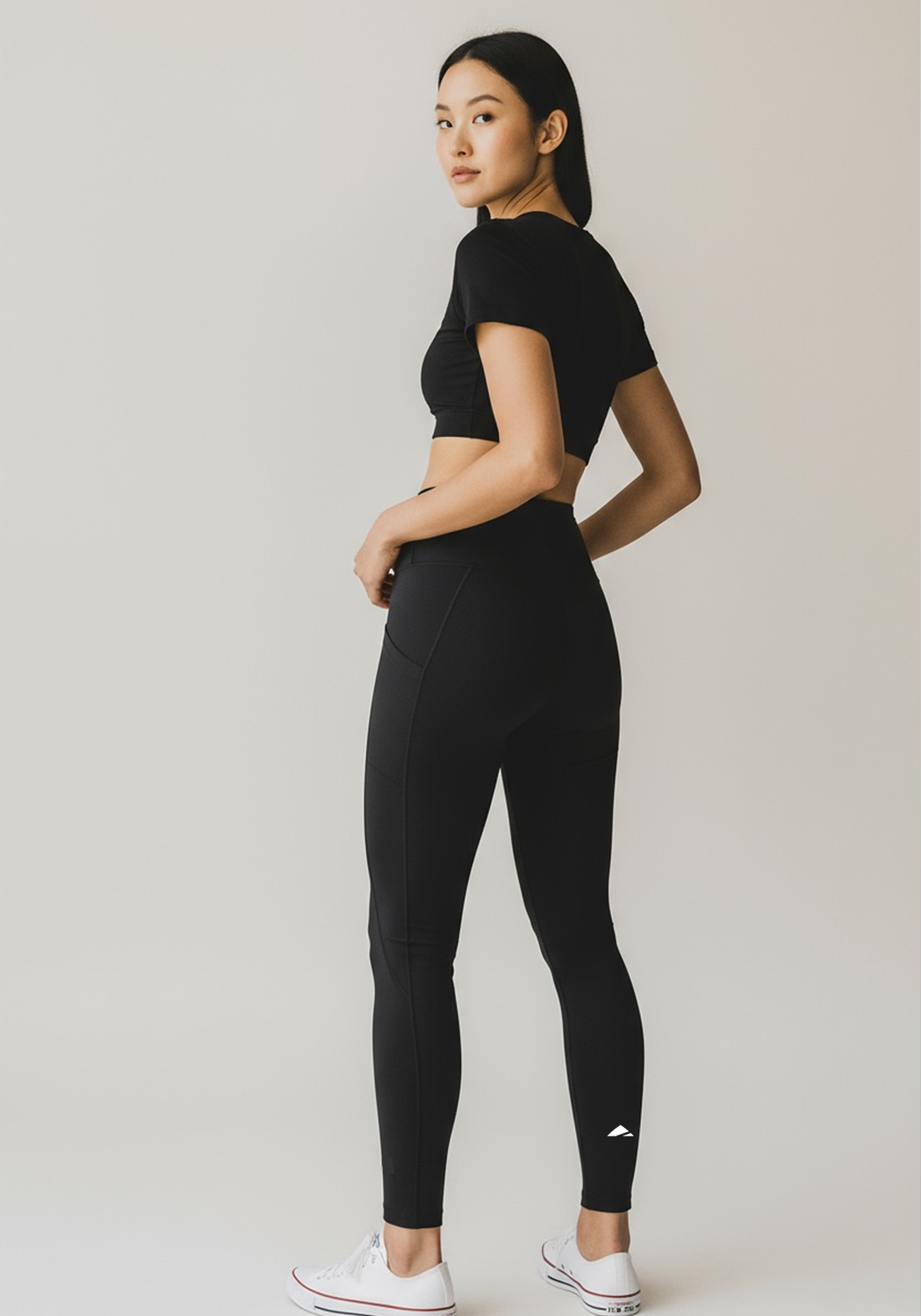 Layer Women’s Vento Training Leggings in black – on-model back view highlighting ergonomic seam lines and flattering silhouette