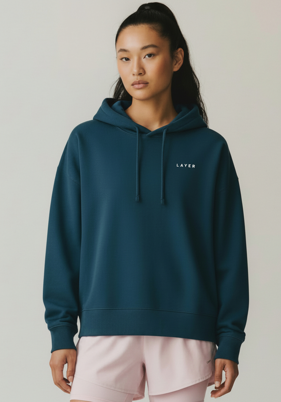 Layer Women's FTR Graphic Hoodie in petrol blue, front view chest logo
