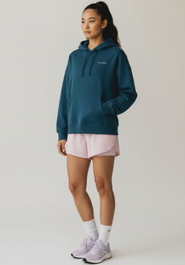 Layer Women's FTR Graphic Hoodie in petrol blue, angled front view
