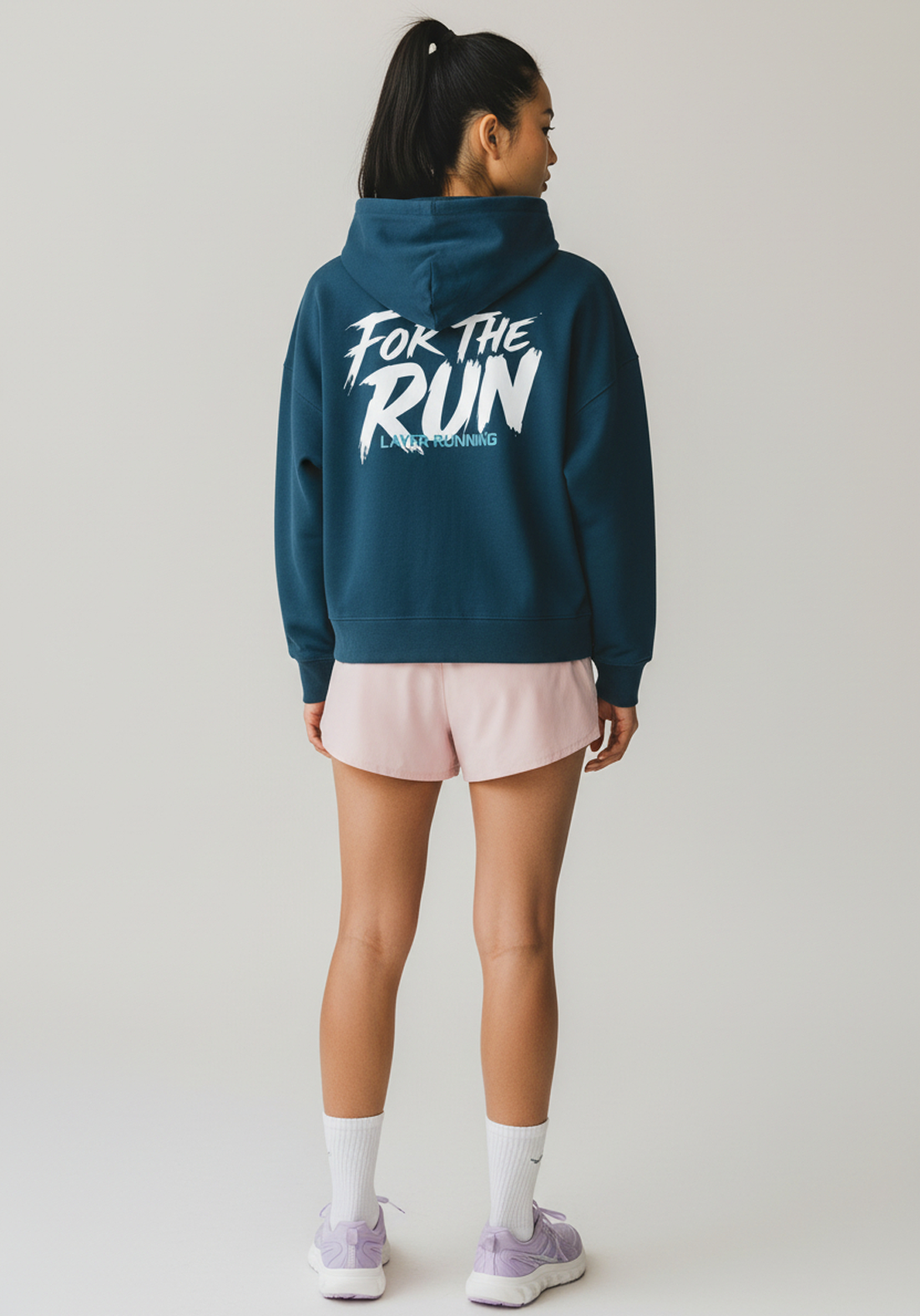 Back view of women’s lavender Layer running hoodie with bold “For The Run” print